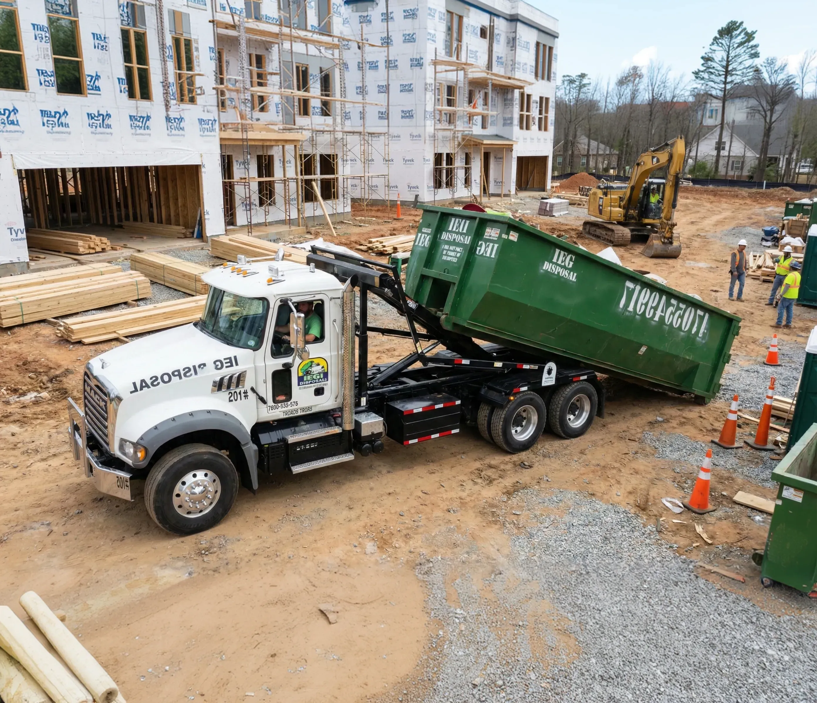 A dumpsters being dropped off in front of a house.
